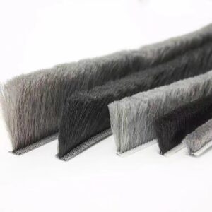 Grey and black brush seal strips with different pile heights on narrow backing strips