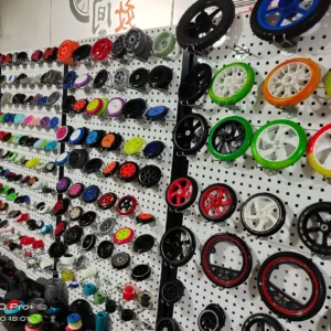 Display wall of wheel samples with different sizes, colours and core designs
