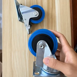 Blue TPR swivel plate caster held to show the wheel hub and mounting bracket