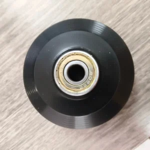 608ZZ bearing close-up in a black Pilates reformer carriage wheel
