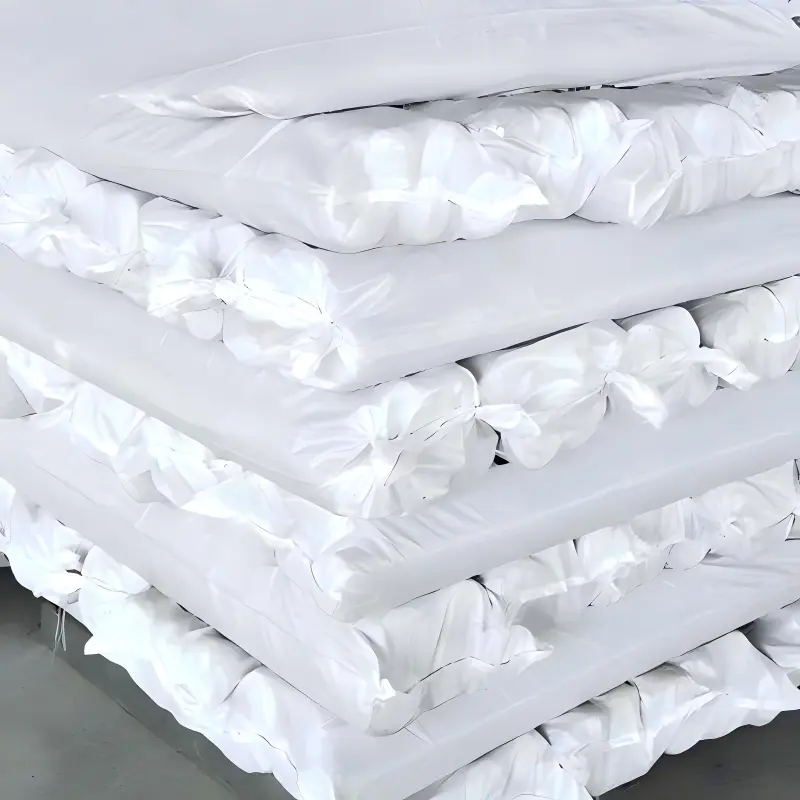 Window screen mesh rolls stacked in individual white protective wrapping